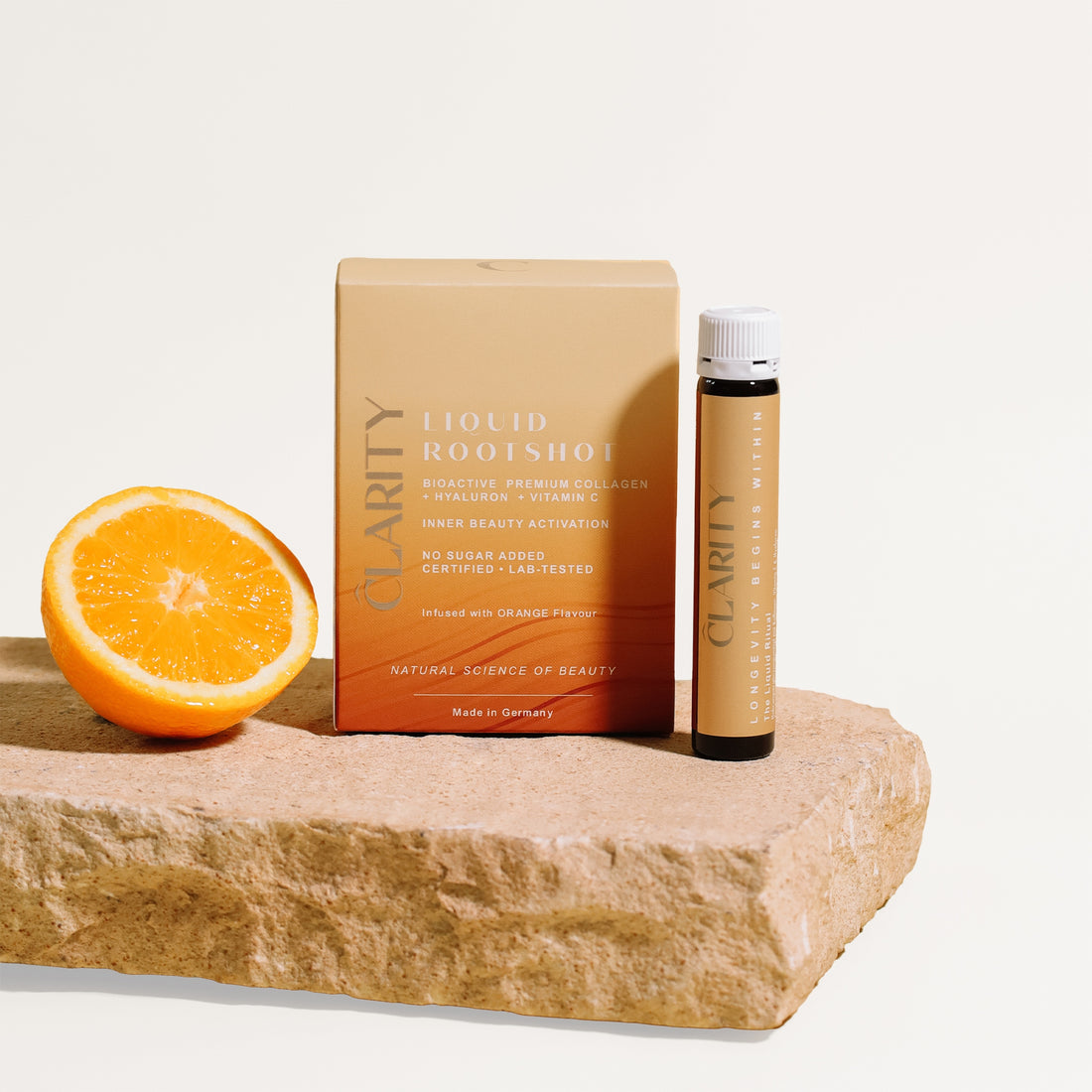 CLARITY LIQUID ROOTSHOT - Bild mit Ampulle und Orange.